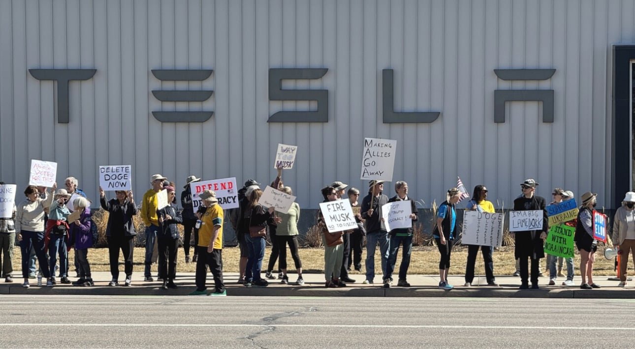 Protesters Rally Against Elon Musk at Tesla Dealerships