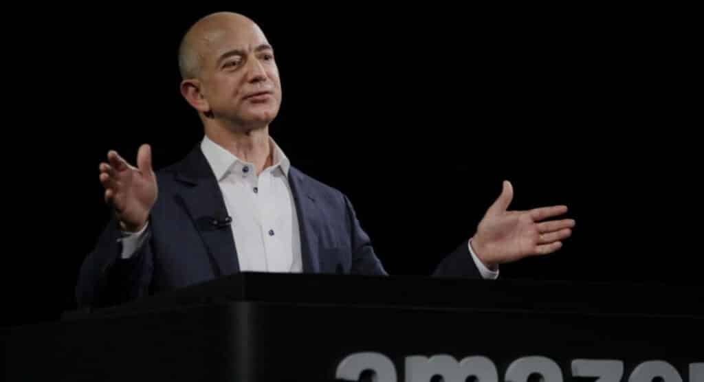"Jeff Bezos at Amazon podium, facing Trump’s tariff heat! Big Tech feels the America First pressure. #AmazonTariffNews #TrumpTariffs #Maga"