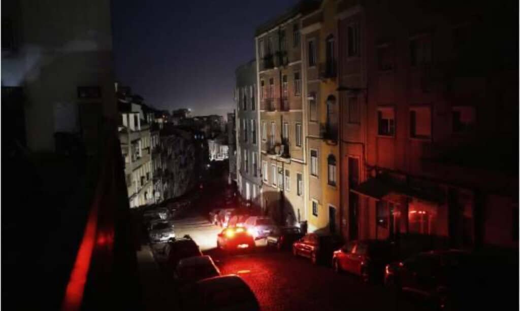 "Lisbon street in darkness during Spain power outage 2025 from green energy failure."