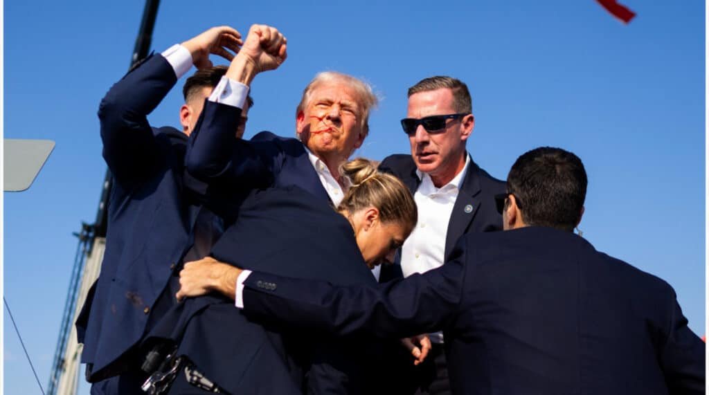 Trump says fight,fight,fight with a fist pump after assasin shot his ear nearly taking his life