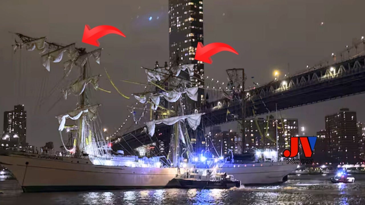 Shocking night scene of the Mexican Navy ship Cuauhtémoc after crashing into the Brooklyn Bridge on May 17, 2025, with broken masts (red arrows) and emergency lights flashing. The iconic bridge looms over a chaotic East River, where two sailors died and 19 were injured. JV Political’s logo stands proud, demanding Trump’s America First policies to secure our borders and landmarks. Read more at JV Political about this wake-up call for patriots! #MAGA #AmericaFirst #BrooklynBridgeCrash Mexican Navy Ship Slams Brooklyn Bridge