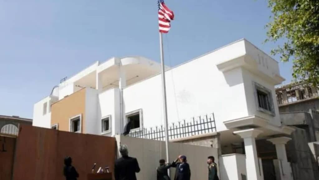 The US embassy in Tripoli proudly flies Old Glory, shutting down fake news about plans to relocate Palestinians to Libya! Diplomats salute the flag under a clear blue sky, standing firm for America First. JV Political brings you the truth—share this to fight liberal lies with MAGA pride!