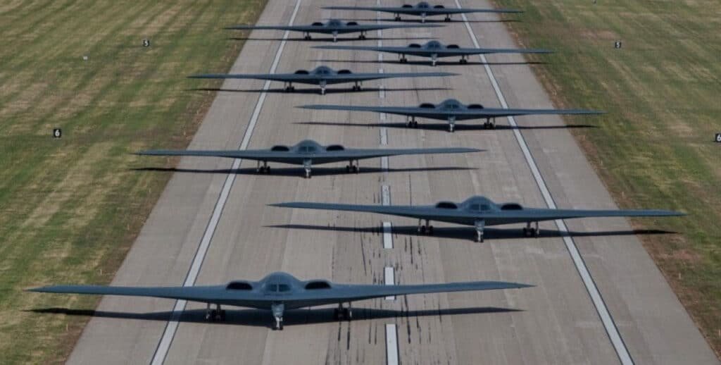 "💥 Epic lineup of B-2 Spirit stealth bombers ready to dominate the skies! ✈️ This jaw-dropping formation screams power—share the ultimate military flex! 🔥 #B2Bomber #USAirForce #StealthSquad"