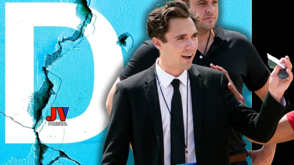 A striking image of David Hogg in a sharp suit, smiling confidently as DNC Vice Chair, with a cracked "D" symbolizing the Democratic Party's collapse, set against a bold blue backdrop. Another figure hands him a note, while the JV Political logo proudly marks the scene—perfect for MAGA fans cheering the chaos! #DavidHogg #DNCCollapse #MAGA #Trump2025 #AmericaFirst #DemocraticCrackup #JVPolitical #PoliticalScandal #GenZPolitics #RedWaveRising
