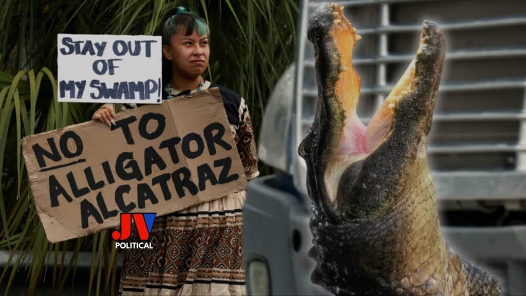 "🌿🐊 SHOCKING PROTEST at Alligator Alcatraz! 🚫 A brave local holds a "Stay Out of My Swamp! No to Alligator Alcatraz" sign as a massive gator looms behind her. Is Florida’s Alligator Alcatraz prison plan crossing the line? Check the Alligator Alcatraz location map debate at JVPolitical.com! Share your take! #AlligatorAlcatraz #FloridaSwamp #BorderFight"